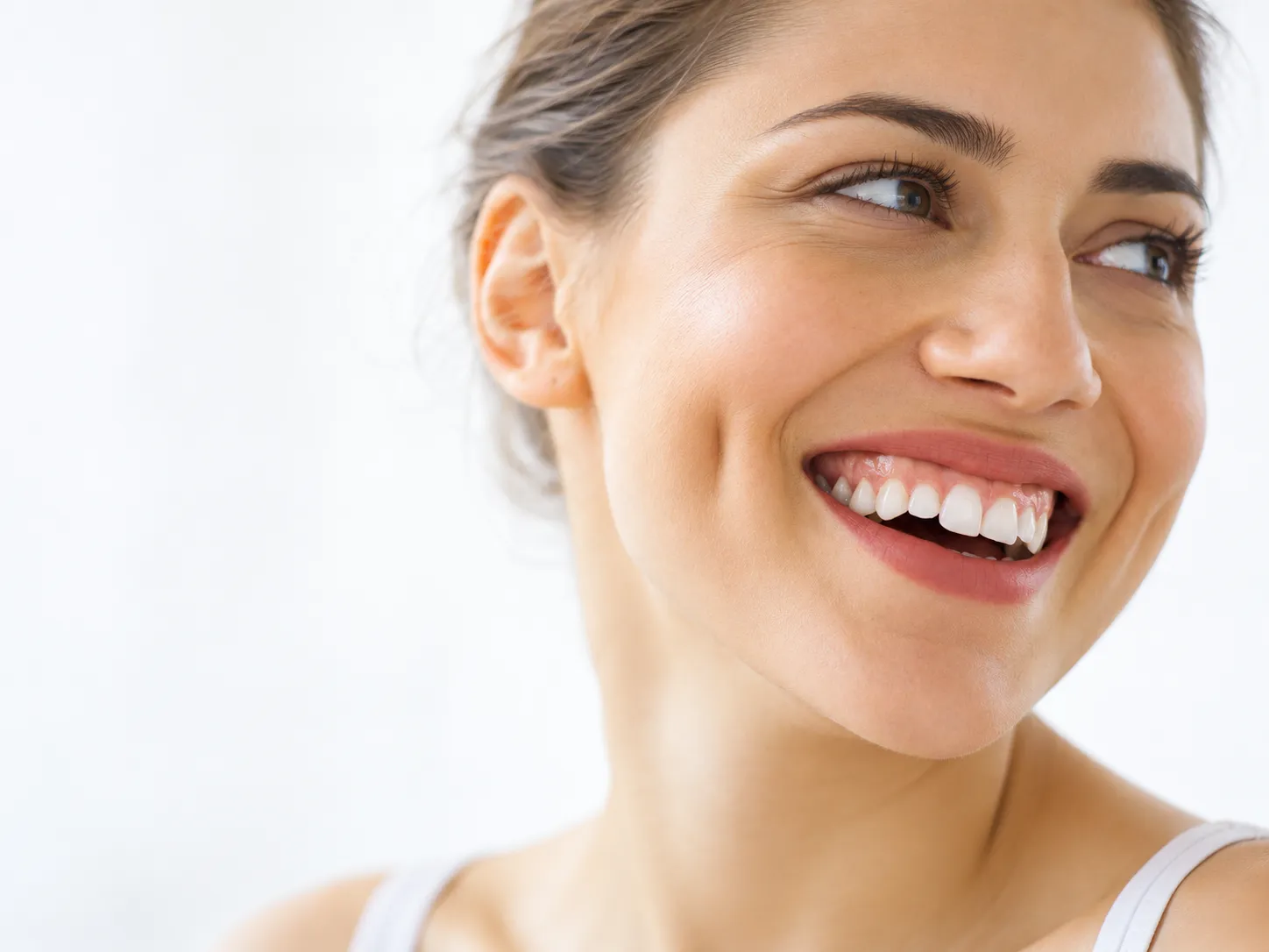 Dimple creation aesthetic procedure on the cheek by a qualified practitioner