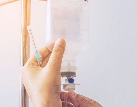 Smiling patient receiving NAD IV therapy at a nearby wellness clinic