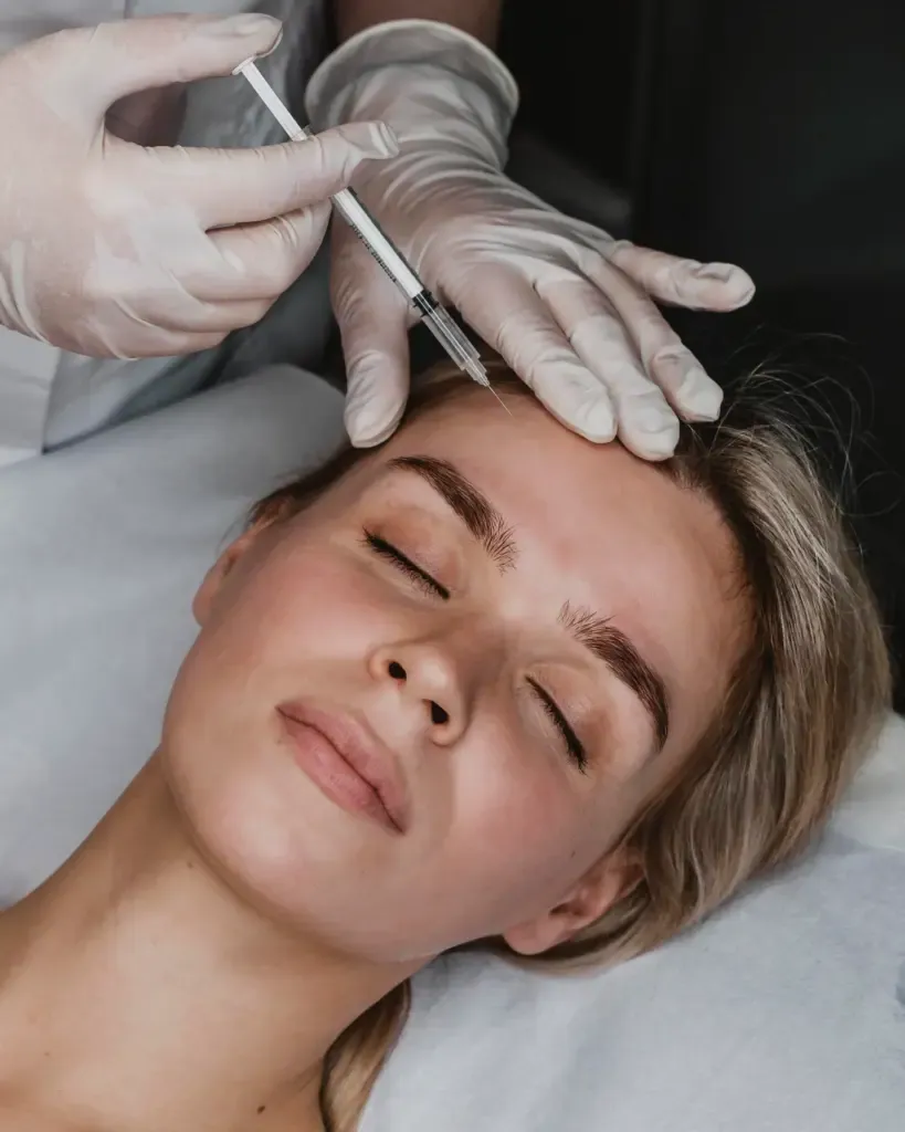 Young woman getting baby botox injection